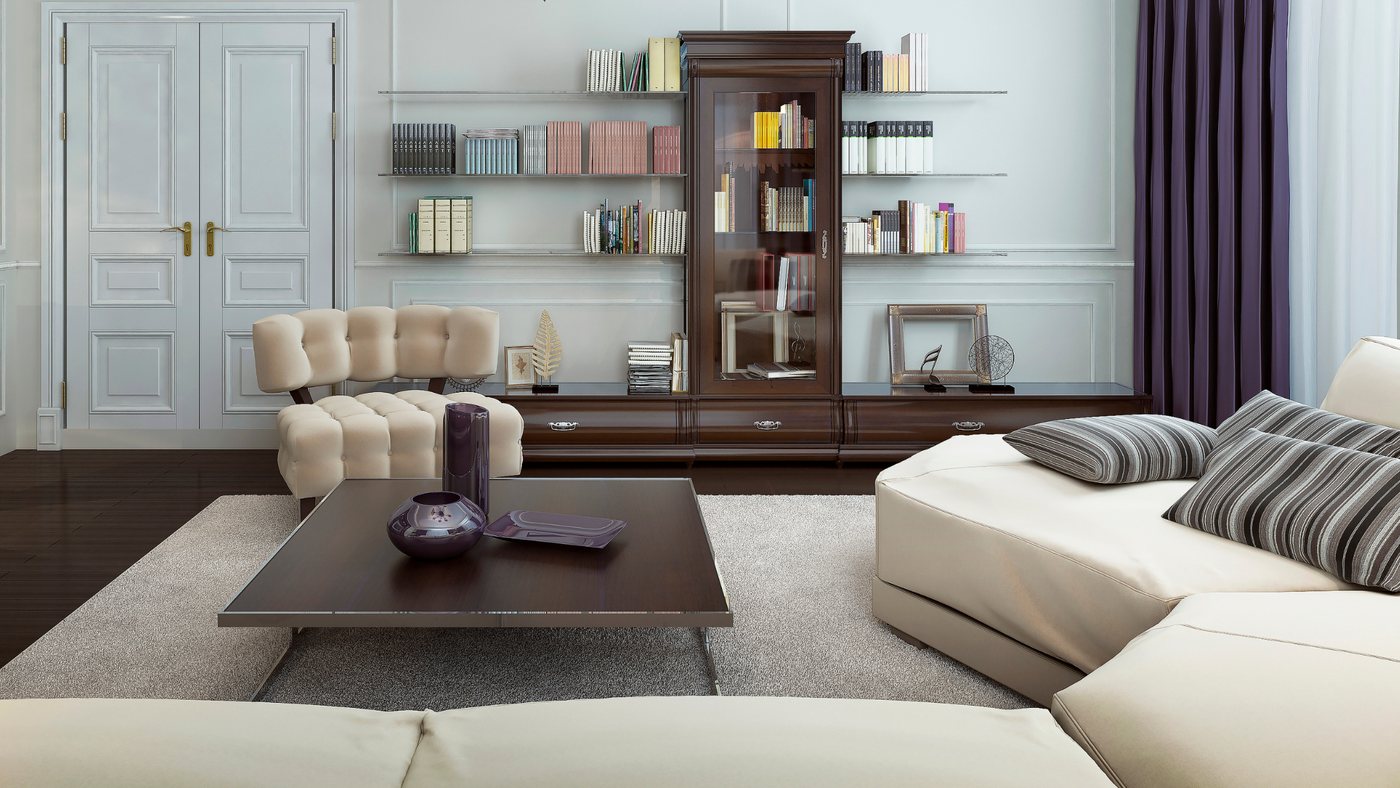 Living room with a curved cream sectional sofa and a low dark wood coffee table