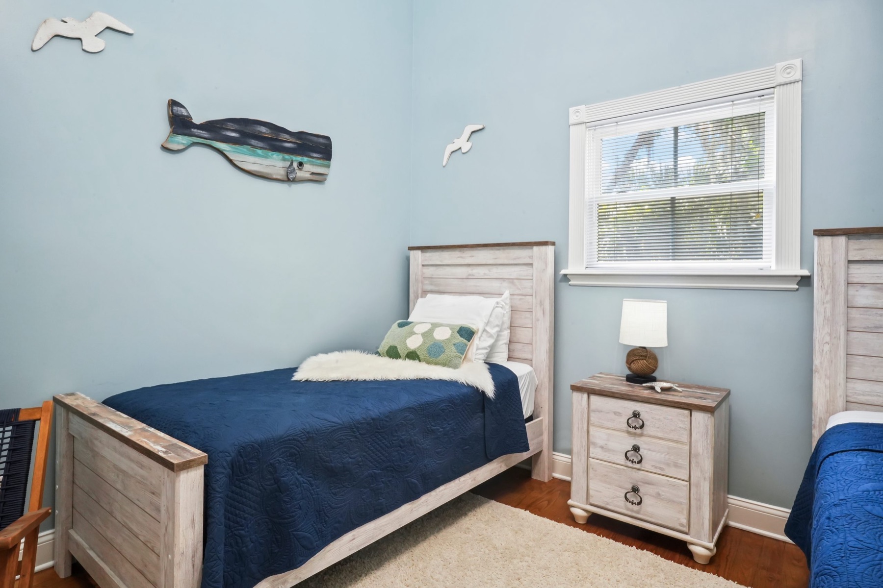 Navy accent room with styled bedding