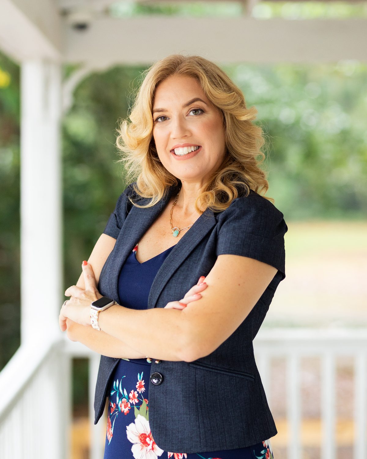 Gina Graham, smiling on a porch