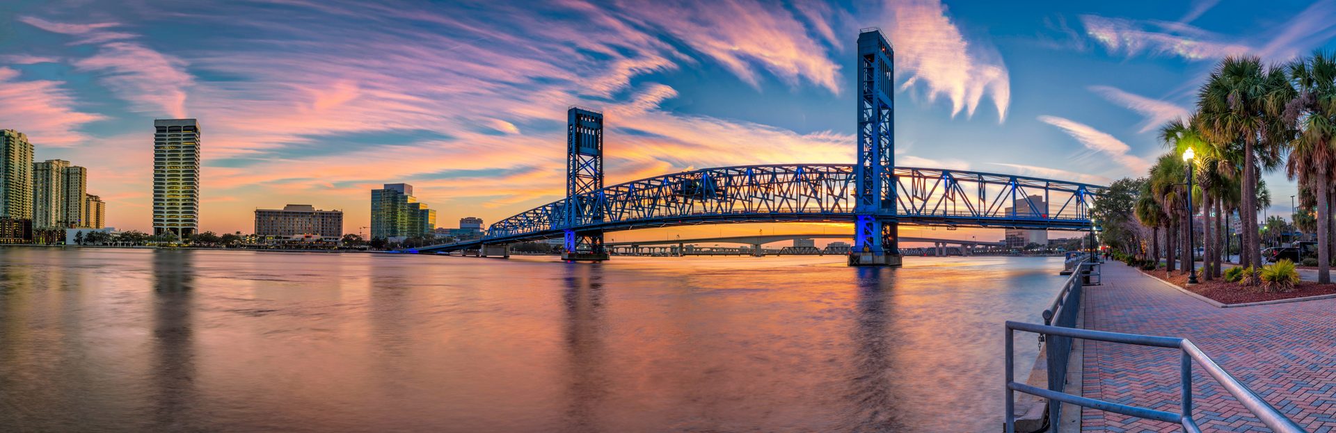 The Main Street Bridge over the St. Johns River at sunset, with the downtown Jacksonville skyline along the water